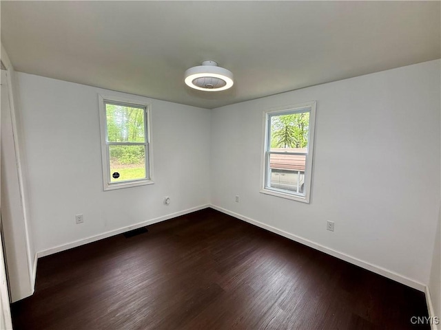 58 Van Ness Rd S, Van Buren, NY 13027 - unfurnished room featuring dark wood-style floors and baseboards