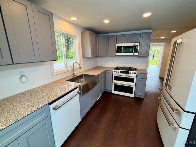 58 Van Ness Rd S, Van Buren, NY 13027 - kitchen featuring white appliances, gray cabinetry, dark wood finished floors, recessed lighting, and light stone countertops