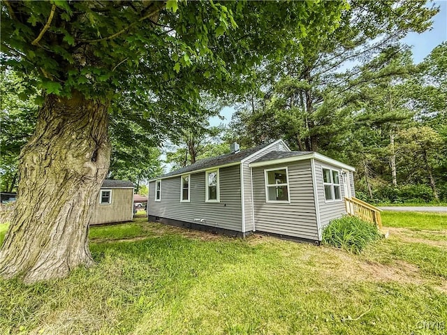 58 Van Ness Rd S, Van Buren, NY 13027 - view of side of home with a yard and a storage shed