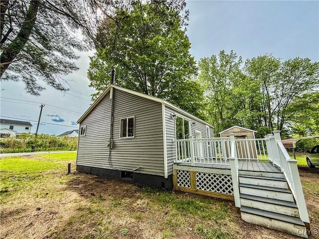 58 Van Ness Rd S, Van Buren, NY 13027 - view of property exterior with a wooden deck, crawl space, and a yard