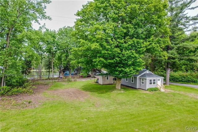 58 Van Ness Rd S, Van Buren, NY 13027 - view of yard featuring an outbuilding and view of wooded area