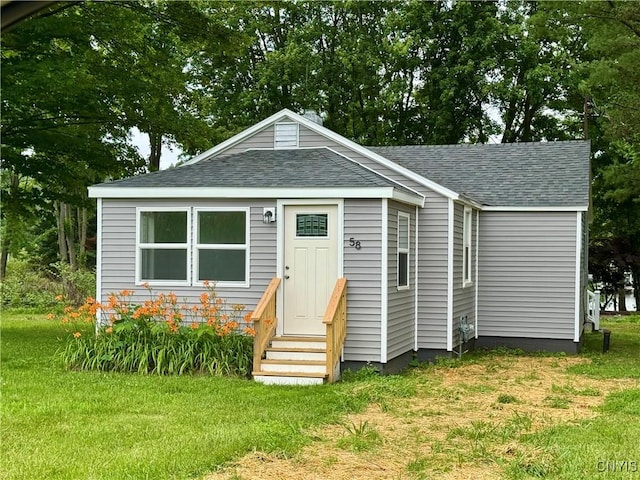 58 Van Ness Rd S, Van Buren, NY 13027 - view of front of home with entry steps, roof with shingles, and a front lawn