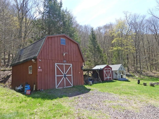 1910 Davis Hollow Rd, Andes, NY 13731 - view of barn with a lawn, a wooded view, and a storage shed
