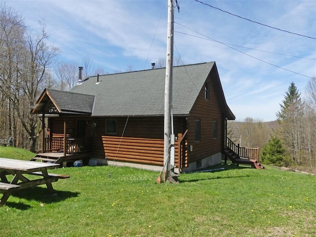 1910 Davis Hollow Rd, Andes, NY 13731 - back of property featuring a yard, a shingled roof, and log siding