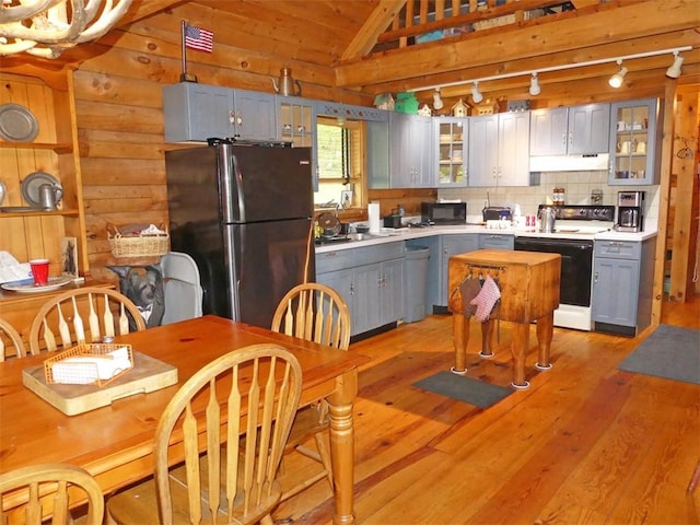 1910 Davis Hollow Rd, Andes, NY 13731 - kitchen with black appliances, gray cabinets, under cabinet range hood, vaulted ceiling, and light countertops