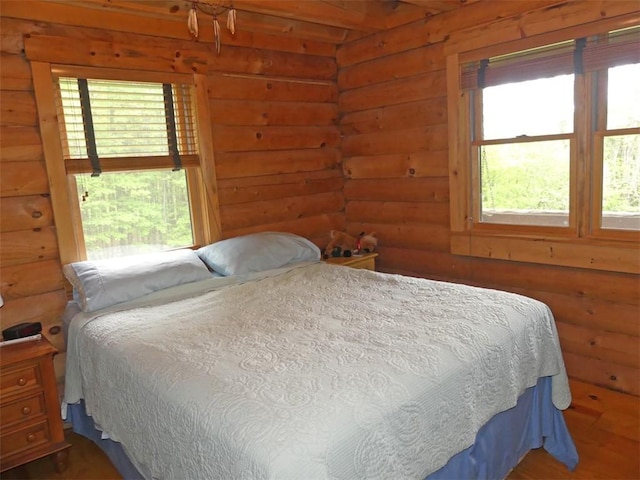 1910 Davis Hollow Rd, Andes, NY 13731 - bedroom featuring rustic walls and wood finished floors