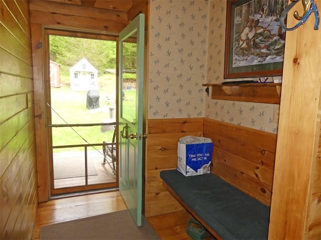 1910 Davis Hollow Rd, Andes, NY 13731 - doorway with wallpapered walls, a wainscoted wall, and wood walls