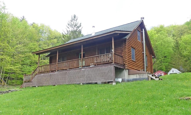1910 Davis Hollow Rd, Andes, NY 13731 - back of house featuring log exterior, a view of trees, and a lawn
