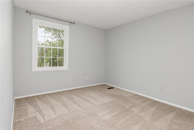 496 Penbrooke Dr, Penfield, NY 14526 - carpeted empty room with baseboards