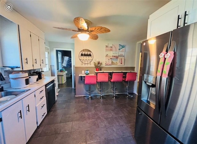 61 Tamarack, Irondequoit, NY 14622 - kitchen with stainless steel fridge, a sink, dishwasher, white cabinets, and a ceiling fan