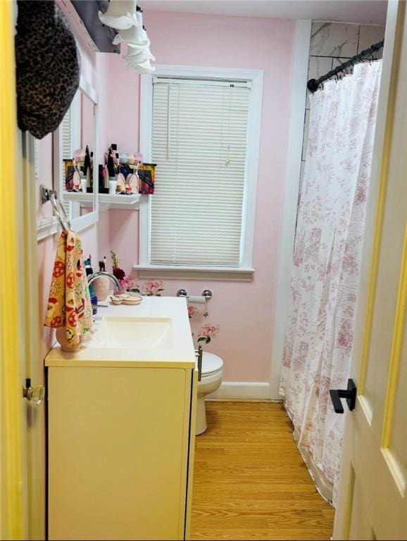 61 Tamarack, Irondequoit, NY 14622 - full bathroom featuring vanity, toilet, wood finished floors, baseboards, and a shower with curtain