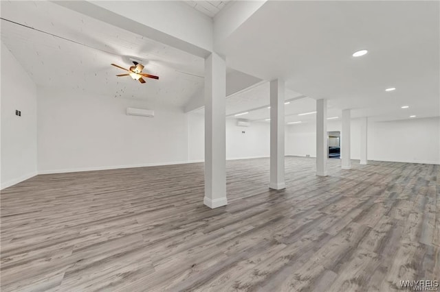 3045 Niagara St, Niagara Falls, NY 14303 - finished basement with wood finished floors, baseboards, recessed lighting, a wall mounted AC, and a ceiling fan