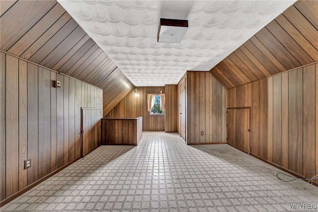 3045 Niagara St, Niagara Falls, NY 14303 - additional living space featuring wood walls, lofted ceiling, and baseboards