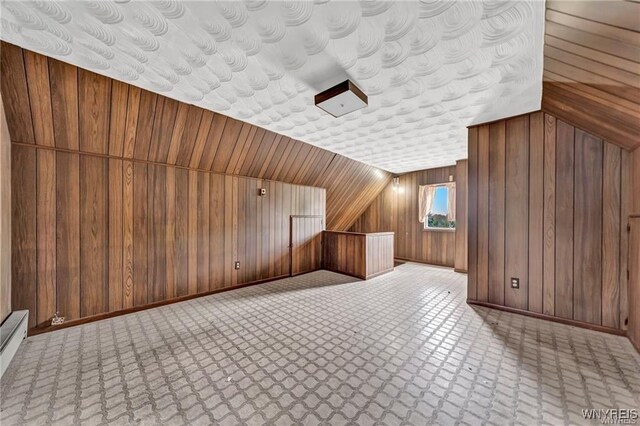3045 Niagara St, Niagara Falls, NY 14303 - bonus room featuring wood walls and baseboards