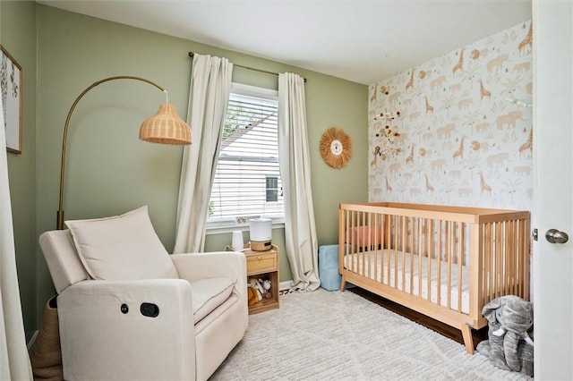 669 Webster Rd, Webster, NY 14580 - bedroom featuring a crib, wallpapered walls, and baseboards
