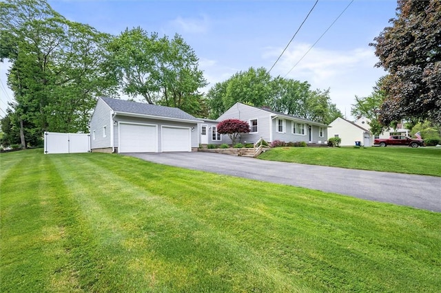 669 Webster Rd, Webster, NY 14580 - ranch-style home with asphalt driveway and a garage