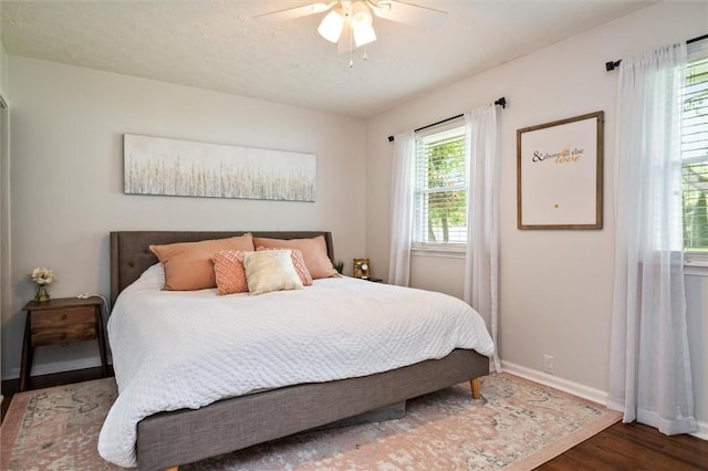 669 Webster Rd, Webster, NY 14580 - bedroom featuring wood finished floors, baseboards, and ceiling fan
