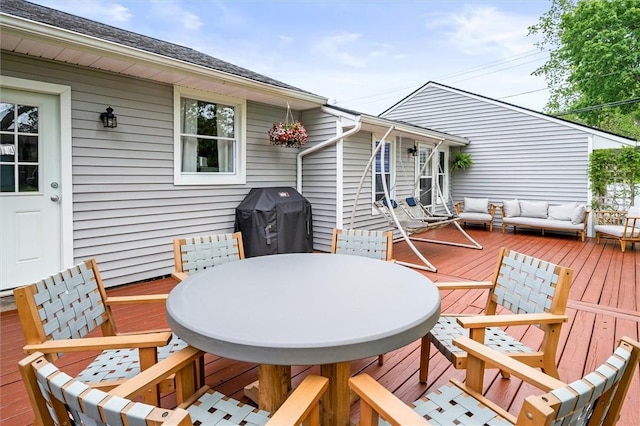 669 Webster Rd, Webster, NY 14580 - wooden terrace with area for grilling, outdoor dining space, and an outdoor hangout area