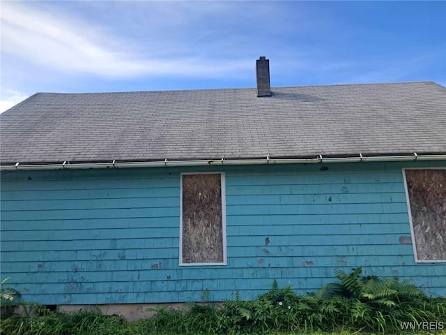 1137 N Ave, Niagara Falls, NY 14305 - exterior view of gutters, roof with shingles, and a chimney