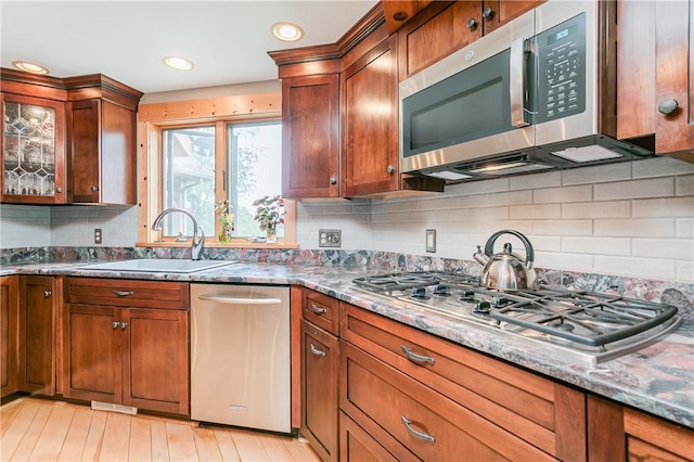 3996 Donley Rd, Italy, NY 14512 - kitchen featuring appliances with stainless steel finishes, a sink, dark stone counters, backsplash, and recessed lighting