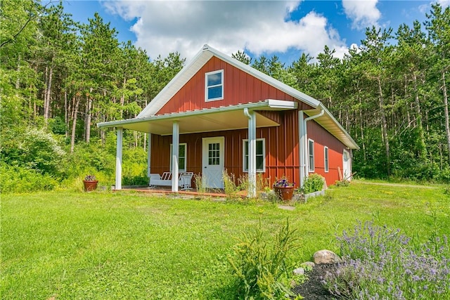 3996 Donley Rd, Italy, NY 14512 - bungalow featuring a porch, a front yard, and a view of trees