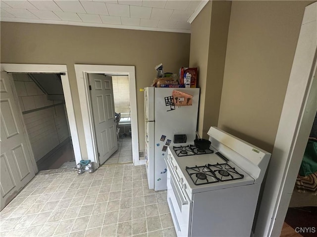 319 Shuart Ave, Syracuse, NY 13203 - kitchen with white appliances and light tile patterned flooring