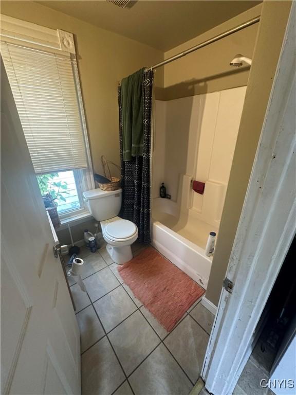 319 Shuart Ave, Syracuse, NY 13203 - full bath featuring toilet, tile patterned flooring, and shower / bathtub combination with curtain