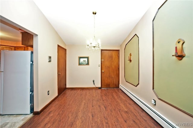 1162 Indian Church Rd Unit 8, West Seneca, NY 14224 - foyer entrance with a baseboard heating unit, wood finished floors, a chandelier, and baseboards