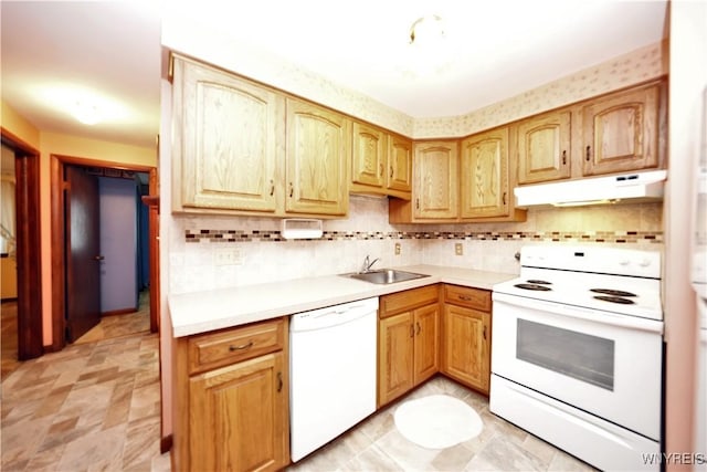 1162 Indian Church Rd Unit 8, West Seneca, NY 14224 - kitchen with white appliances, under cabinet range hood, a sink, light countertops, and tasteful backsplash