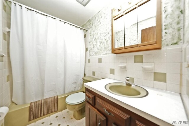 1162 Indian Church Rd Unit 8, West Seneca, NY 14224 - bathroom with toilet, vanity, shower / bath combination with curtain, and tile walls
