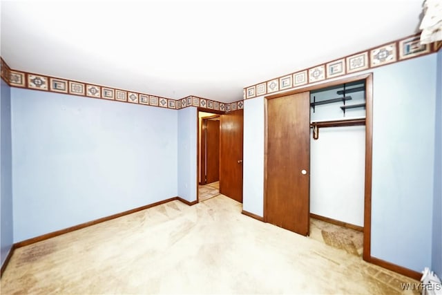 1162 Indian Church Rd Unit 8, West Seneca, NY 14224 - unfurnished bedroom with a closet, baseboards, and carpet