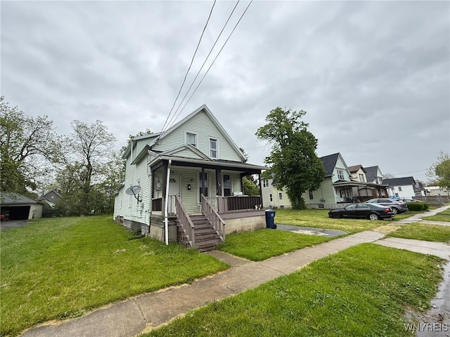 134 French St, Buffalo, NY 14211 - view of front of property with covered porch and a front lawn