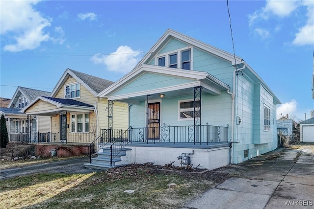46 Wilkes Ave, Buffalo, NY 14215 - view of front of property with covered porch and asphalt driveway