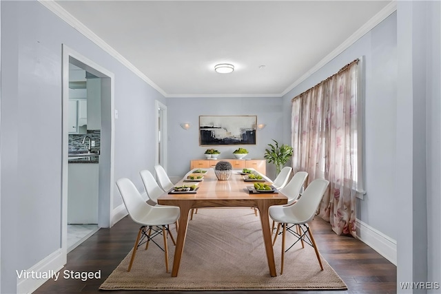 46 Wilkes Ave, Buffalo, NY 14215 - dining area featuring baseboards, dark wood-style flooring, and crown molding