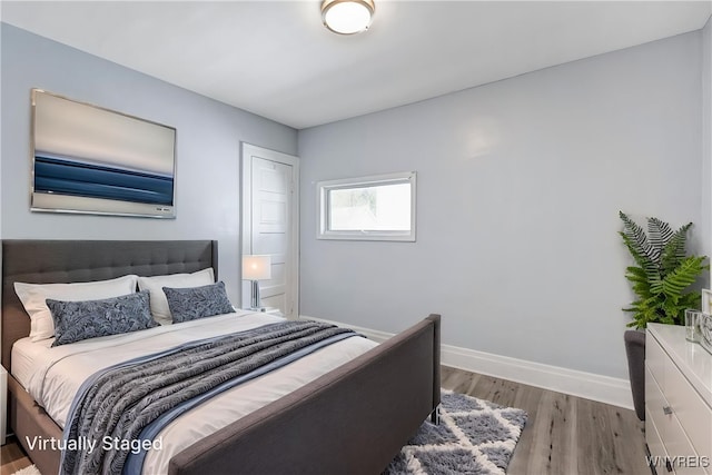 46 Wilkes Ave, Buffalo, NY 14215 - bedroom featuring baseboards and wood finished floors