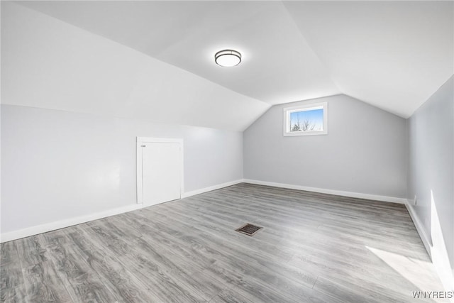 46 Wilkes Ave, Buffalo, NY 14215 - additional living space with lofted ceiling, wood finished floors, and baseboards