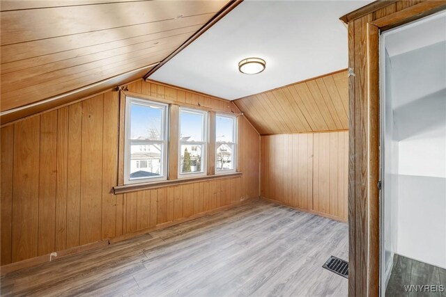 46 Wilkes Ave, Buffalo, NY 14215 - additional living space featuring vaulted ceiling, wooden walls, and wood finished floors
