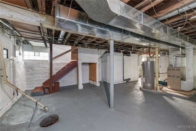 46 Wilkes Ave, Buffalo, NY 14215 - basement with water heater, heating unit, and stairs