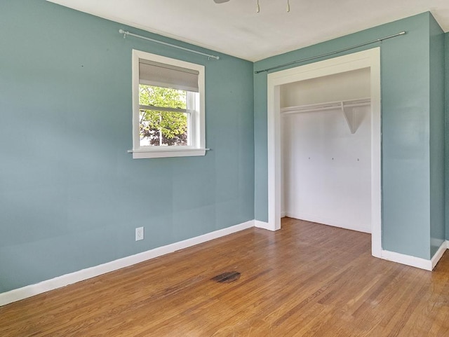 13 W Crest Dr, Gates, NY 14606 - unfurnished bedroom featuring baseboards, a closet, and wood finished floors