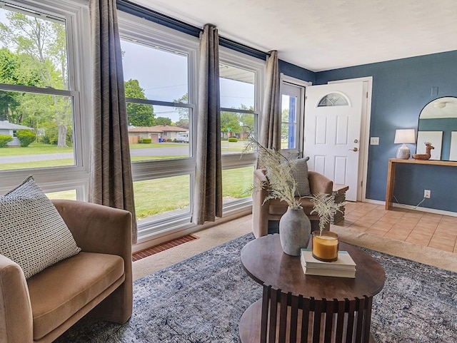 13 W Crest Dr, Gates, NY 14606 - tiled living area with plenty of natural light and baseboards