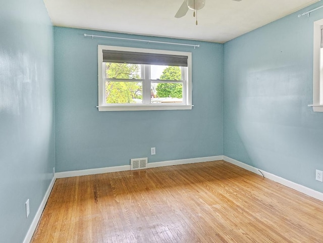 13 W Crest Dr, Gates, NY 14606 - empty room with wood finished floors, ceiling fan, and baseboards