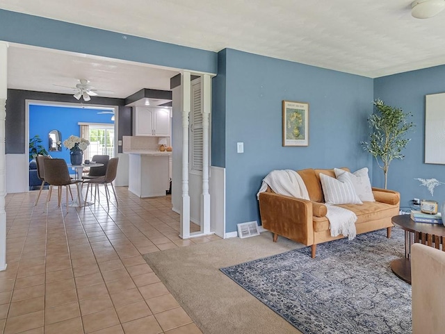 13 W Crest Dr, Gates, NY 14606 - living room featuring light tile patterned floors, ceiling fan, and baseboards