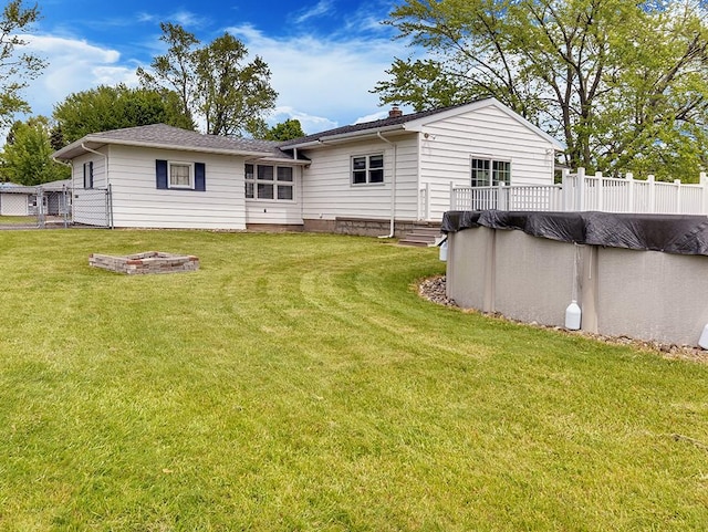 13 W Crest Dr, Gates, NY 14606 - rear view of property featuring a covered pool and a deck