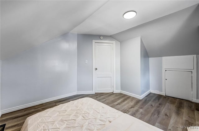 57 Davidson Ave, Buffalo, NY 14215 - bedroom featuring vaulted ceiling, wood finished floors, and baseboards