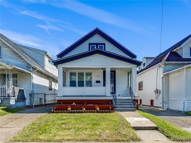 57 Davidson Ave, Buffalo, NY 14215 - shotgun-style home featuring a porch, a front lawn, and a gate