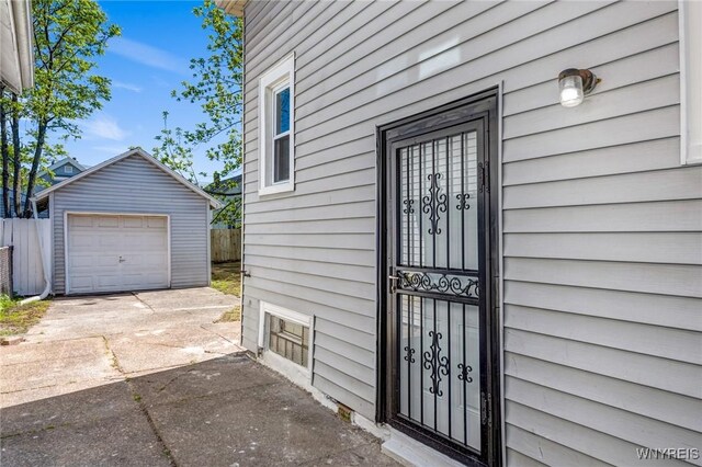 57 Davidson Ave, Buffalo, NY 14215 - property entrance featuring concrete driveway and a detached garage