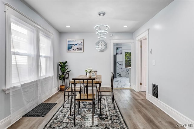 57 Davidson Ave, Buffalo, NY 14215 - dining area with wood finished floors, baseboards, recessed lighting, and a chandelier