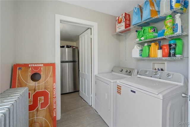 184 Liberty St, Oswego-City, NY 13126 - laundry area featuring radiator and washing machine and dryer