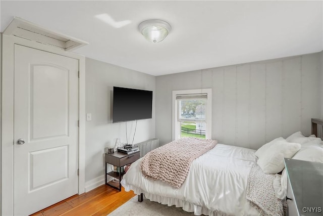 184 Liberty St, Oswego-City, NY 13126 - bedroom featuring light wood-type flooring, attic access, and baseboards