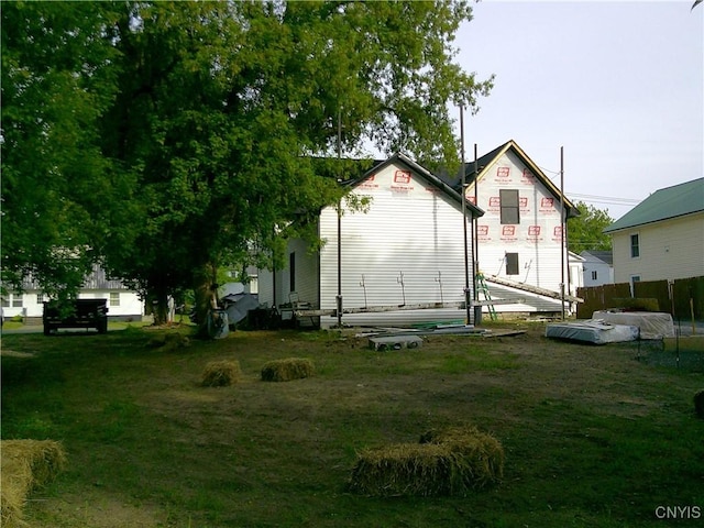 8457 S Main St, Le Ray, NY 13637 - rear view of house featuring a yard
